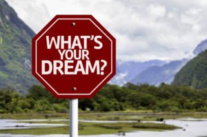 What's your Dream? red sign with a landscape background