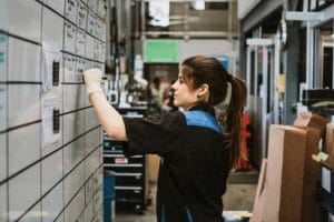 Make Appointments with Yourself to Achieve Great Success with AutoFix Auto Shop Coaching; image of female auto shop owner scheduling out on large white dry erase calendar