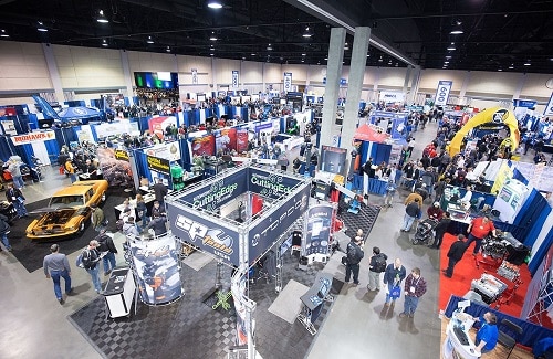 Conference Calendar for 2023 and Beyond | Chris Cotton at AutoFix Auto Shop Coaching. Top view of trade show and exhibition hall.