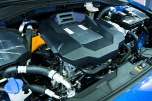 EV and hybrid repair, auto shop coaching by AutoFix Auto Shop Coaching. Detailed view of a modern hybrid powertrain showcasing advanced components, clean wiring, and high-efficiency design—representing innovation and the future of auto repair training and shop development.