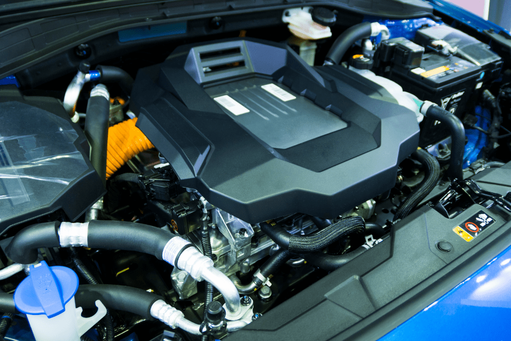 EV and hybrid repair, auto shop coaching by AutoFix Auto Shop Coaching. Detailed view of a modern hybrid powertrain showcasing advanced components, clean wiring, and high-efficiency design—representing innovation and the future of auto repair training and shop development.